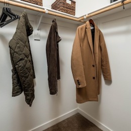 a closet with clothes