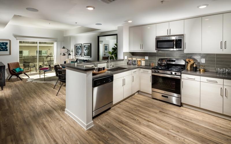 a kitchen with white cabinets