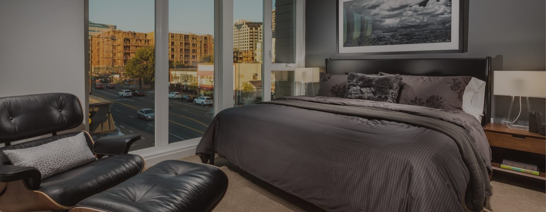 a bedroom with a bed and a chair