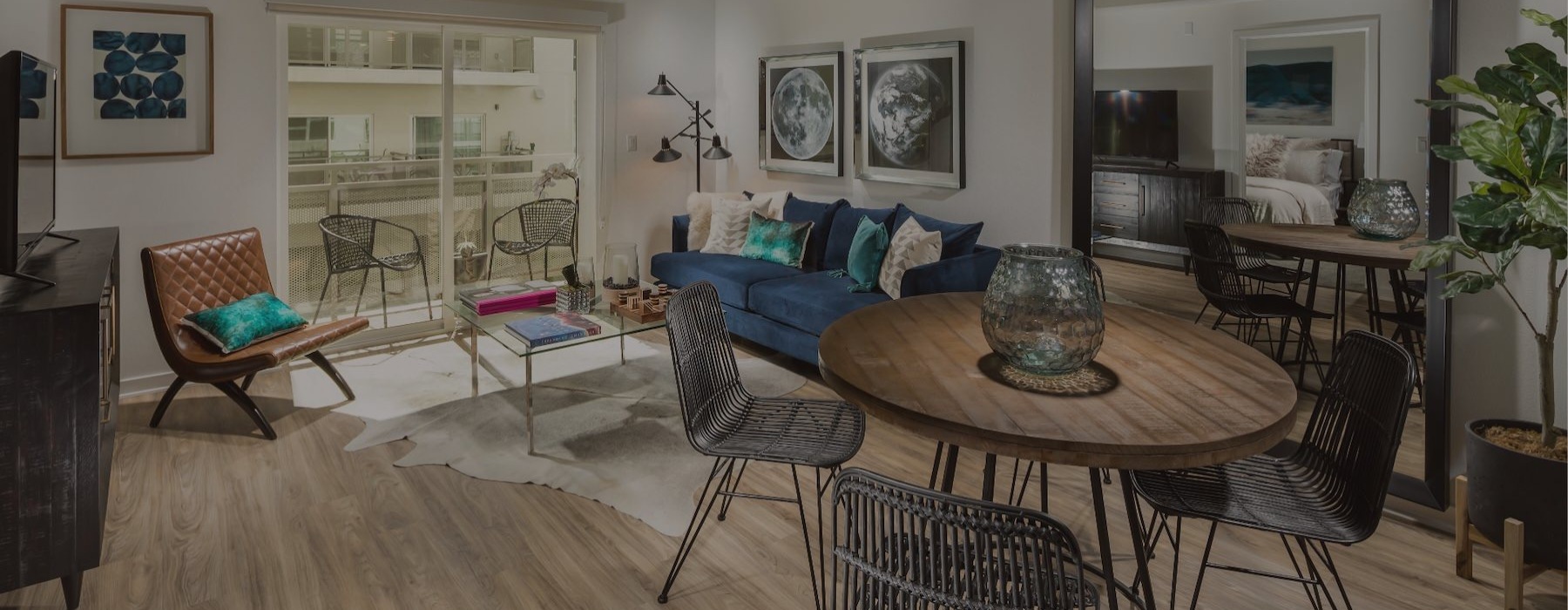 a living room with a couch, tables and chairs